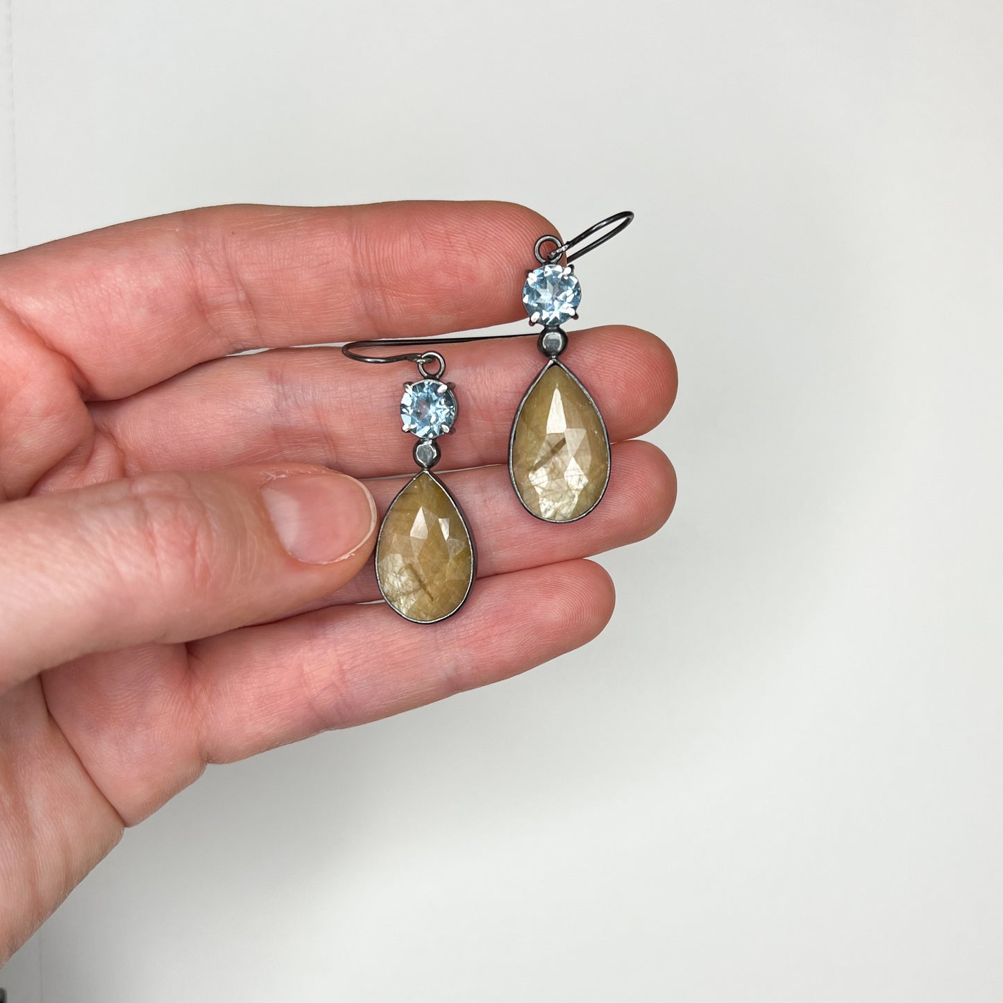 Sky blue topaz and sapphire pair of earrings