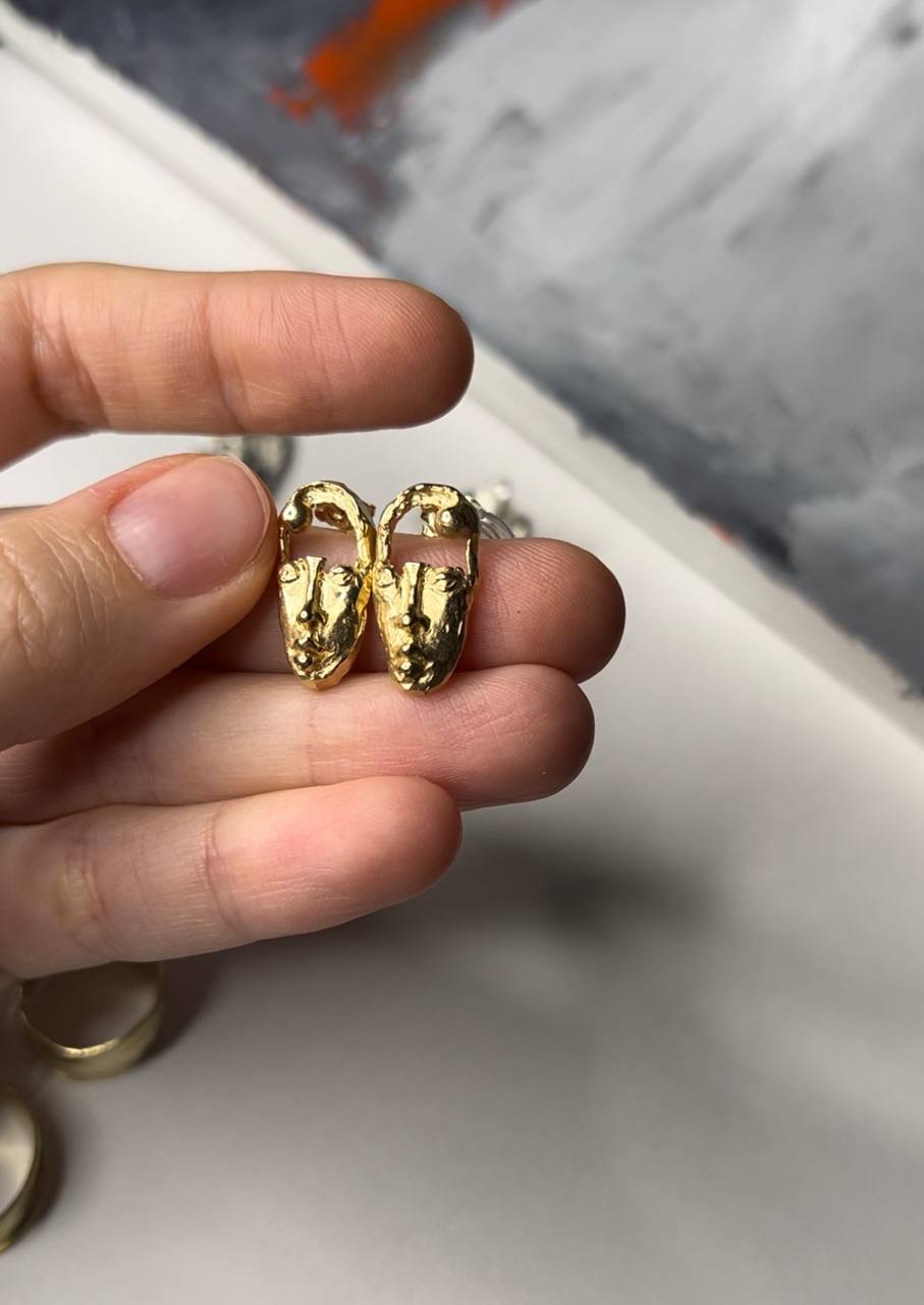 14 carat yellow gold face stud earrings
